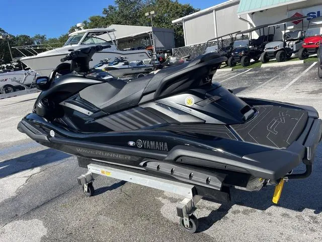 Slide: The Image of 2024 Yamaha Waverunner FX SVHO® with Audio System in black, parked on a trailer. - 8