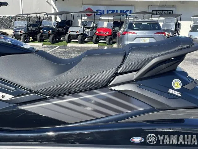 Slide: The Image of 2024 Yamaha Waverunner FX SVHO® with Audio System, black, side view, parked near Suzuki dealership. - 9