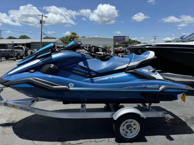 Slide: The Image of 2024 Yamaha Waverunner FX Cruiser® HO with Audio System, blue, on a trailer, outdoor display. - 5