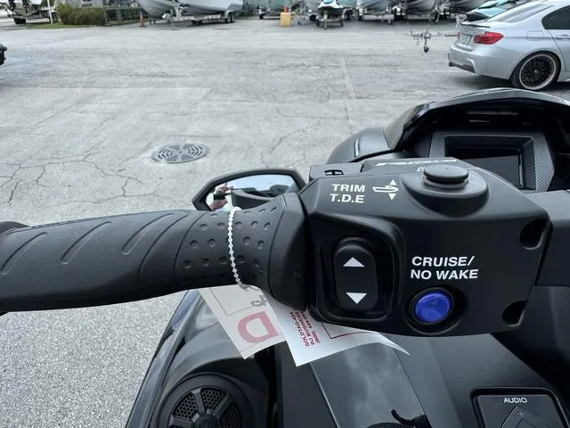 Slide: The Image of Close-up of 2024 Yamaha Waverunner GP SVHO™ handlebar controls with cruise and trim features. - 12