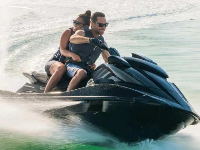Slide: The Image of 2024 Yamaha Waverunner GP SVHO™ with Audio on water, two riders enjoying speed. - 20