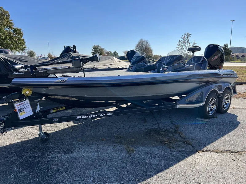 Slide: The Image of 2024 Ranger Z520R Ranger Cup Equipped bass boat on trailer in parking lot. - 0