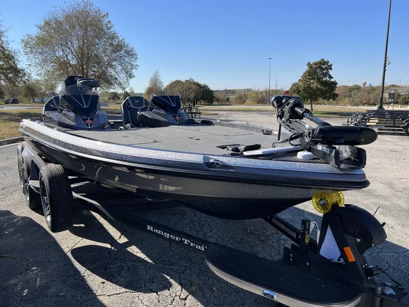 Slide: The Image of 2024 Ranger Z520R Ranger Cup Equipped bass boat on trailer in parking lot. - 2