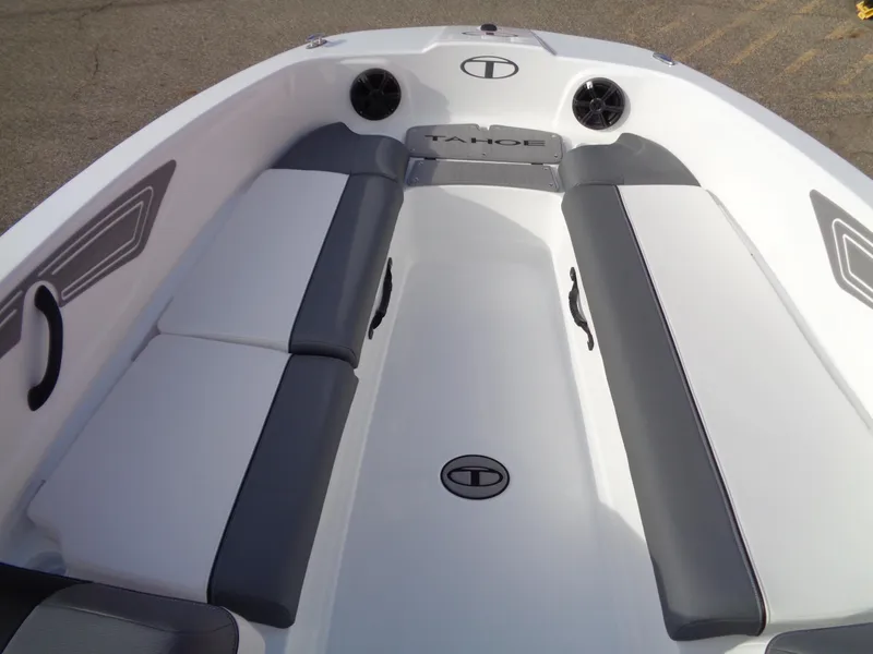 Slide: The Image of 2024 Tahoe T21 boat interior with gray and white seating. - 13