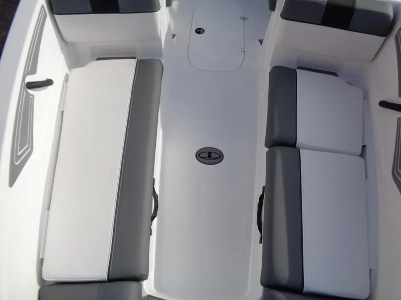 Slide: The Image of 2024 Tahoe T21 boat interior with white and gray seating. - 14