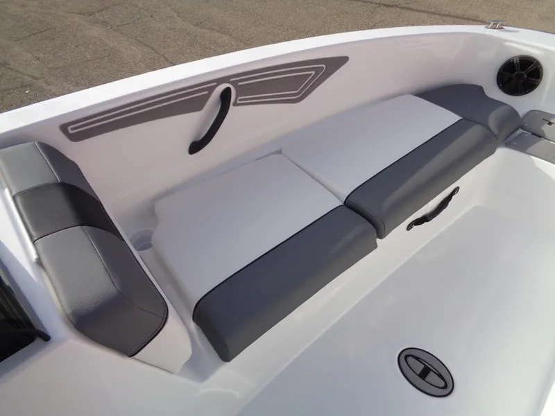 Slide: The Image of 2024 Tahoe T21 boat interior with cushioned seating and modern design. - 16