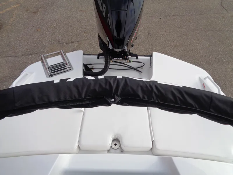 Slide: The Image of 2024 Tahoe T21 boat stern with outboard motor and swim ladder. - 18