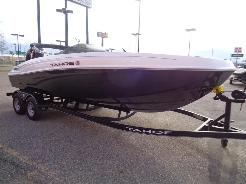 Slide: The Image of 2024 Tahoe T21 boat on trailer in parking lot. - 4