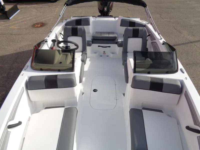 Slide: The Image of 2024 Tahoe T21 boat interior with seating and steering wheel. - 6