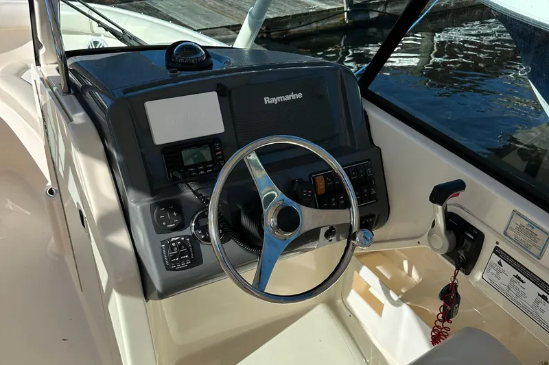 Slide: The Image of 2012 Pursuit DC 265 Dual Console boat helm with Raymarine electronics. - 13
