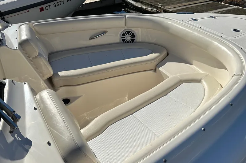 Slide: The Image of 2012 Pursuit DC 265 Dual Console boat with spacious seating area. - 16