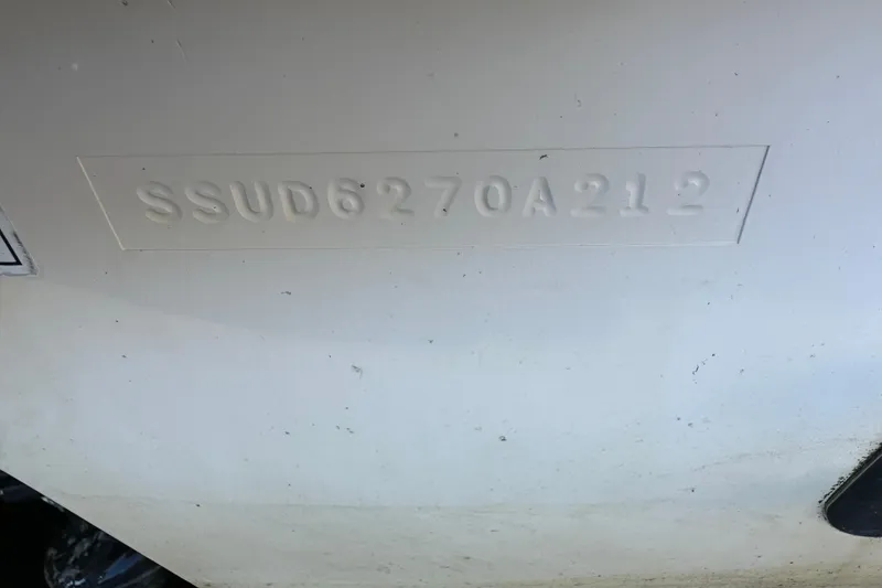 Slide: The Image of Hull identification number (HIN) on a 2012 Pursuit DC 265 Dual Console boat. - 26