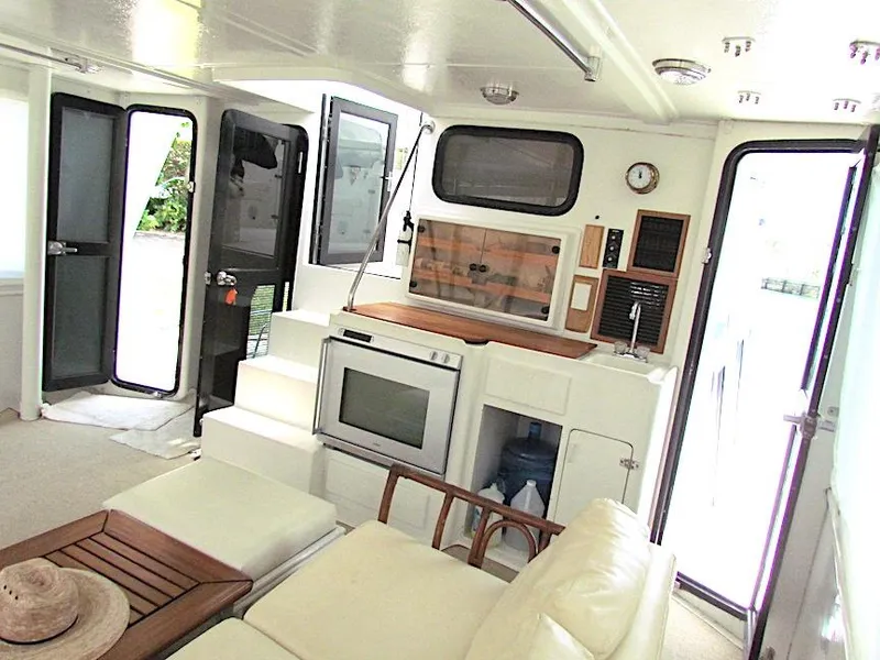 Slide: The Image of Interior of 1997 Hyatt 55 yacht with modern amenities and comfortable seating. - 10