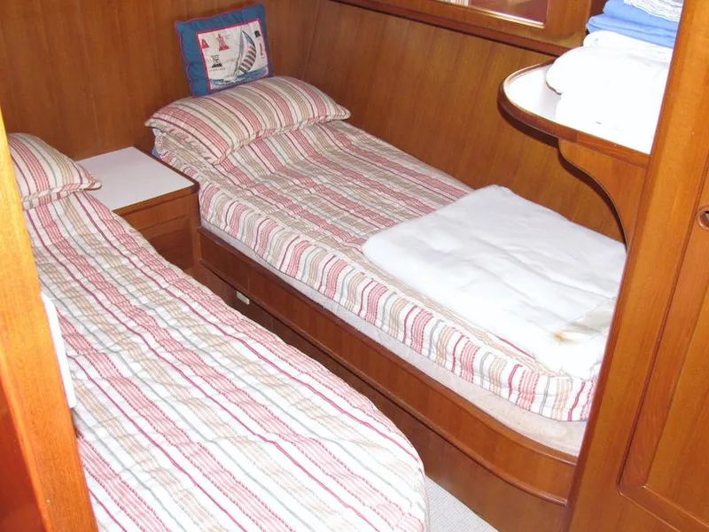 Slide: The Image of Twin beds in a cozy wooden cabin on a 1997 Hyatt 55 yacht. - 13