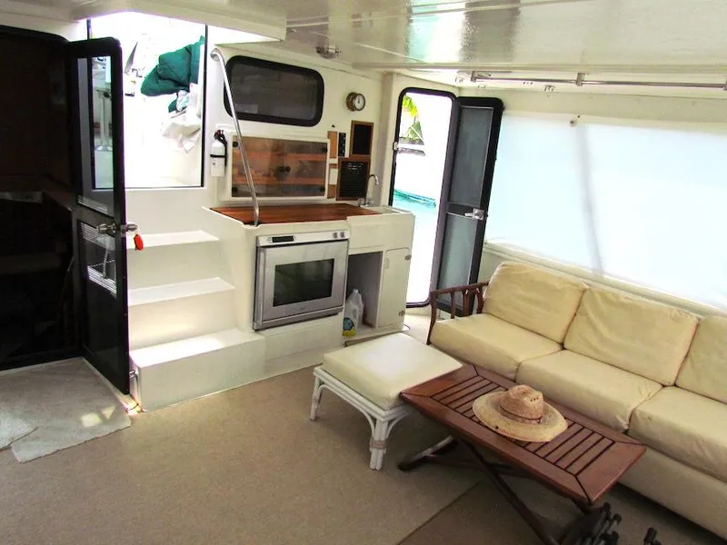 Slide: The Image of Spacious interior of a 1997 Hyatt 55 yacht with a cozy seating area. - 8