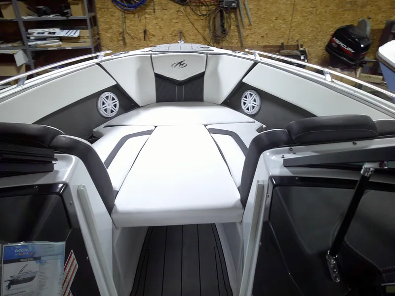 Slide: The Image of 2023 Monterey 238 Super Sport boat interior with white and black seating. - 4
