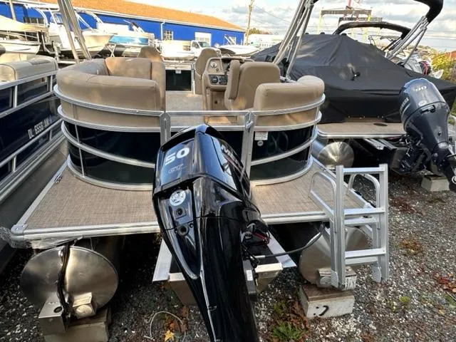 Slide: The Image of 2024 Starcraft LX 18 F pontoon boat with 50 HP outboard motor. - 6