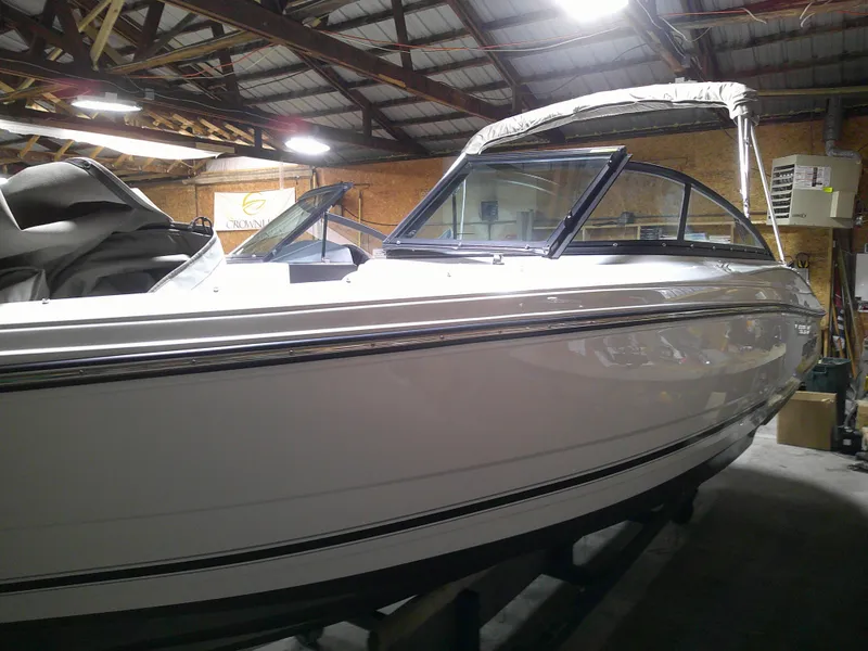 Slide: The Image of 2023 Monterey 224FS boat in a storage facility. - 2