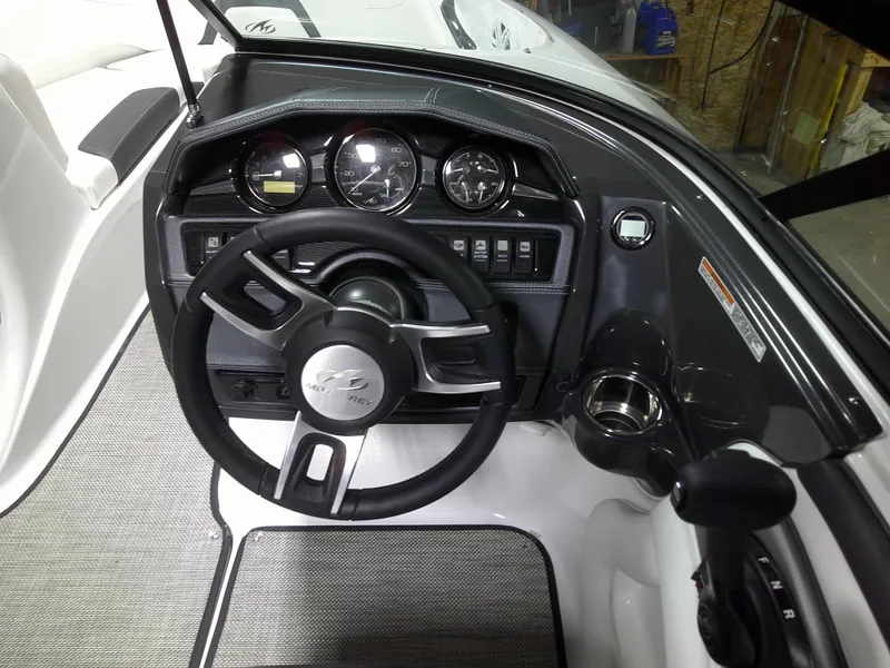 Slide: The Image of 2023 Monterey 224FS boat dashboard with steering wheel and instrument panel. - 4