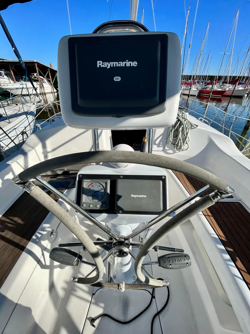 Slide: The Image of 2008 Hunter 38 sailboat helm with Raymarine navigation system. - 12