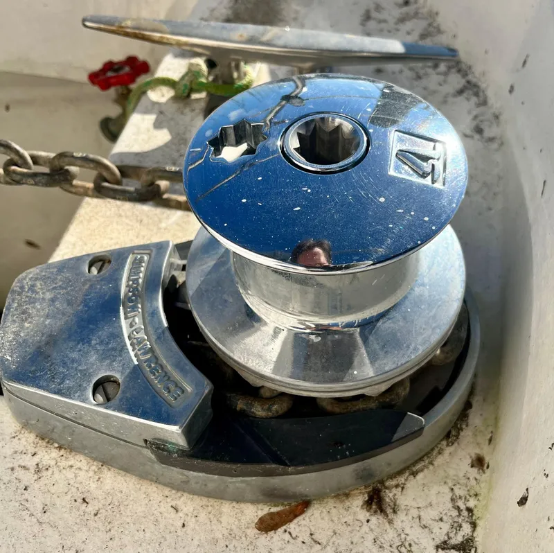 Slide: The Image of Chrome anchor windlass on a 2008 Hunter 38 sailboat deck. - 15