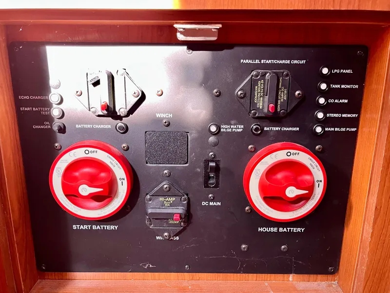 Slide: The Image of Control panel of a 2008 Hunter 38 sailboat with battery switches and indicators. - 26