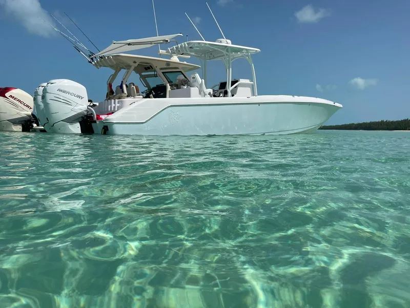 Slide: The Image of 2023 CG Boat Works 35 M-Series in clear turquoise water. - 11