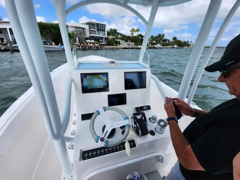 Slide: The Image of 2023 CG Boat Works 35 M-Series console with dual screens on the water. - 12