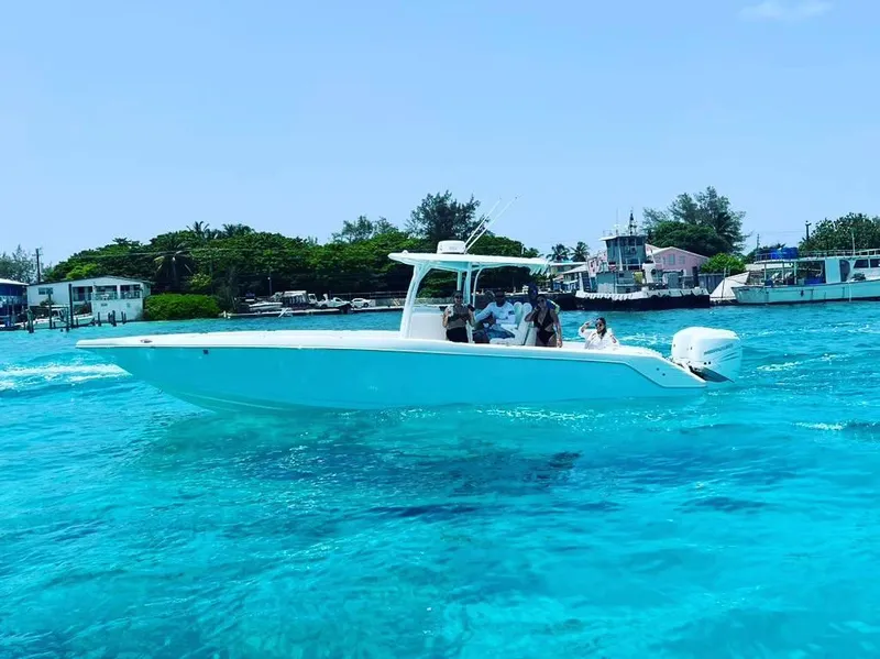 Slide: The Image of 2023 CG Boat Works 35 M-Series cruising in clear blue waters. - 14