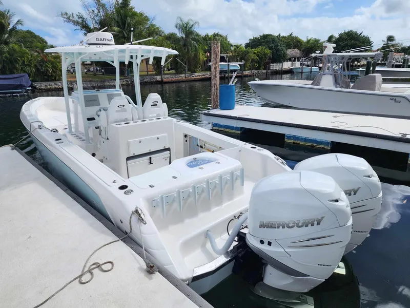 Slide: The Image of 2023 CG Boat Works 35 M-Series docked, featuring dual Mercury outboard engines. - 17
