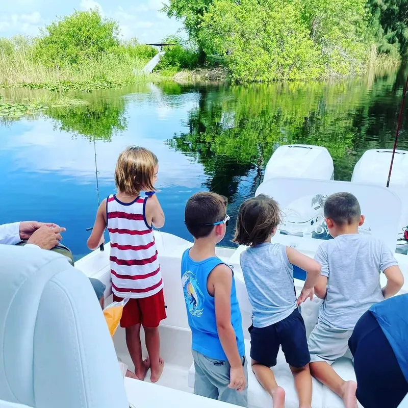 Slide: The Image of Children enjoying a boat ride on a 2023 CG Boat Works 35 M-Series. - 23