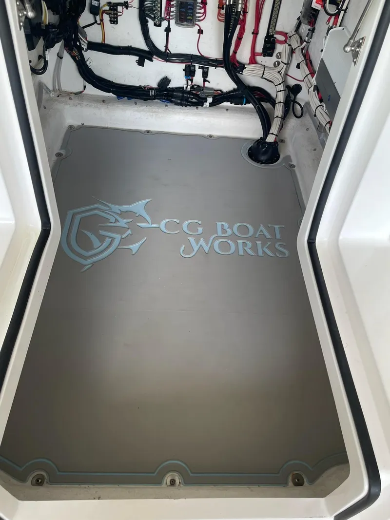 Slide: The Image of 2023 CG Boat Works 35 M-Series engine compartment with logo. - 31