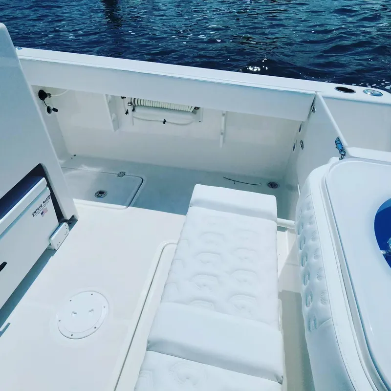 Slide: The Image of 2023 CG Boat Works 35 M-Series deck with seating and storage compartments. - 41