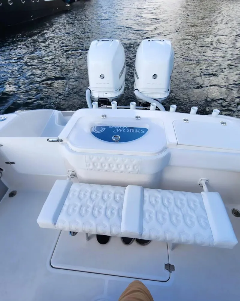 Slide: The Image of 2023 CG Boat Works 35 M-Series with dual outboard motors on water. - 43