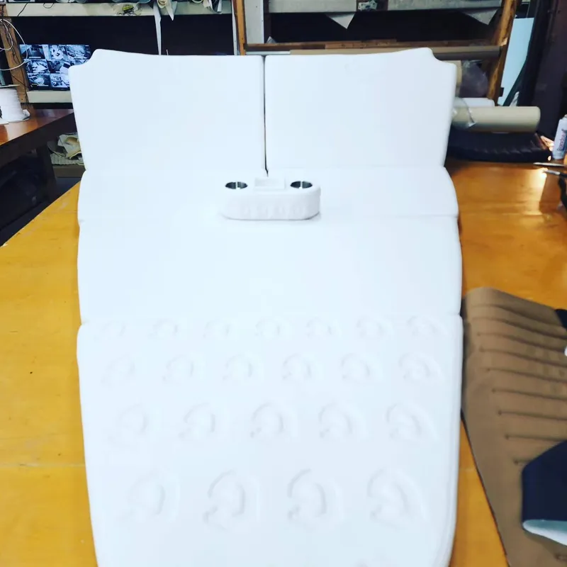 Slide: The Image of White seat cushion for CG Boat Works 35 M-Series 2023 model on a workbench. - 46