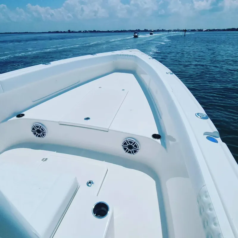 Slide: The Image of 2023 CG Boat Works 35 M-Series on open water, showcasing spacious deck and sleek design. - 47