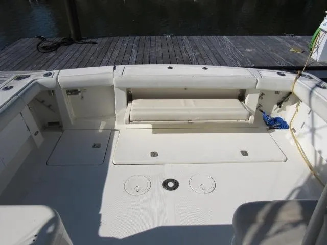 Slide: The Image of 1995 Tiara Yachts 3700 Open boat deck with seating and storage compartments. - 10