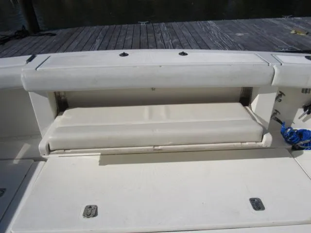 Slide: The Image of 1995 Tiara Yachts 3700 Open boat seating and storage compartment. - 11