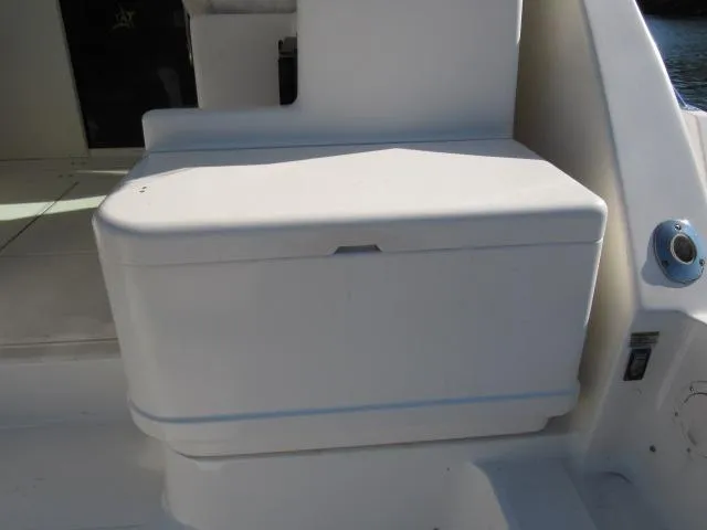 Slide: The Image of 1995 Tiara Yachts 3700 Open seating area with storage compartment. - 17