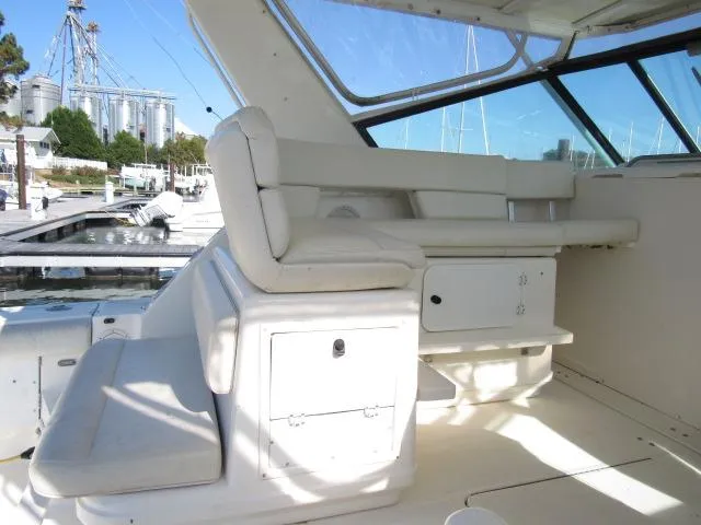Slide: The Image of 1995 Tiara Yachts 3700 Open interior seating area at the marina. - 19