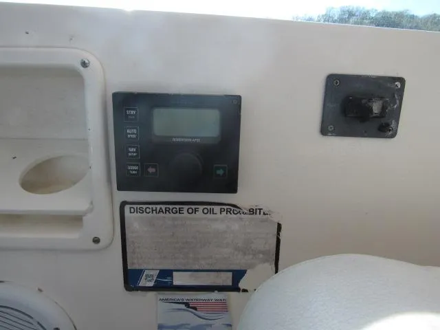 Slide: The Image of Control panel and warning label on a 1995 Tiara Yachts 3700 Open. - 22