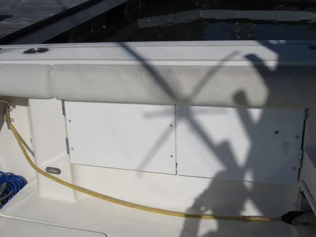 Slide: The Image of 1995 Tiara Yachts 3700 Open boat interior with cushioned seating and storage compartments. - 24