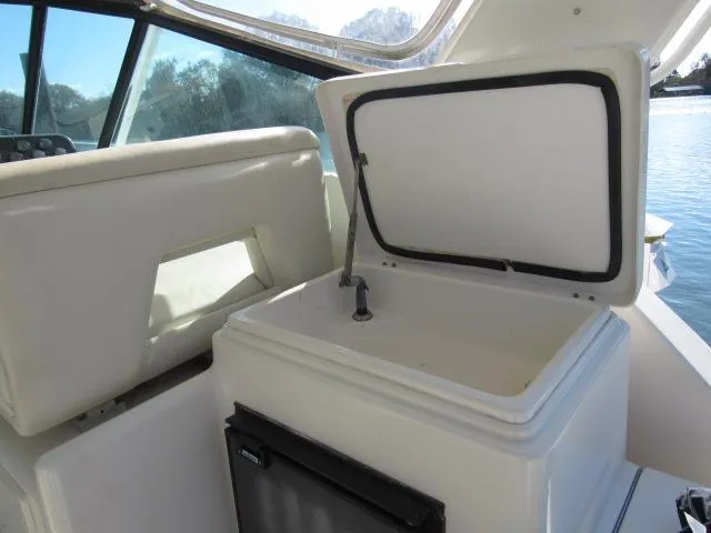 Slide: The Image of 1995 Tiara Yachts 3700 Open interior with open storage compartment. - 30
