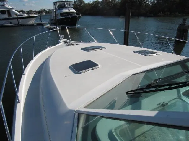 Slide: The Image of 1995 Tiara Yachts 3700 Open boat on water, front deck view. - 38