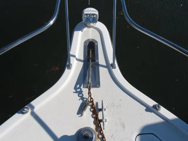Slide: The Image of Bow of 1995 Tiara Yachts 3700 Open with anchor chain and railing. - 39