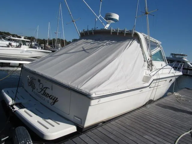 Slide: The Image of 1995 Tiara Yachts 3700 Open docked at a marina. - 44