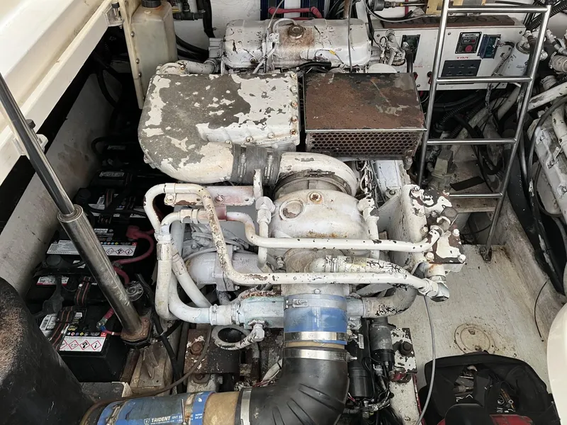 Slide: The Image of 1995 Tiara Yachts 3700 Open engine compartment with visible machinery and components. - 7