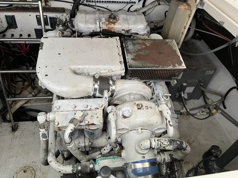 Slide: The Image of 1995 Tiara Yachts 3700 Open engine compartment showing machinery and components. - 8
