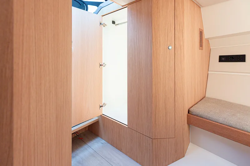 Slide: The Image of Interior of 2024 Sichterman T38 yacht with wooden cabinetry and seating. - 15