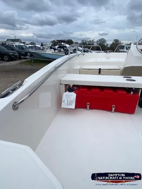 Slide: The Image of 2024 Boston Whaler 160 Super Sport boat interior with red fuel tank, Hampton Watercraft & Marine. - 12